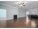 Spacious living room featuring hardwood floors and a gas fireplace at 131 E Northstone Rd, Mooresville, NC 28115