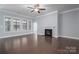 Bright and airy living room with hardwood floors and fireplace at 131 E Northstone Rd, Mooresville, NC 28115