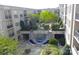 Residential courtyard with a central fountain and landscaping at 1315 East Blvd # 203, Charlotte, NC 28203