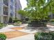 Well-maintained residential courtyard with benches and landscaping at 1315 East Blvd # 203, Charlotte, NC 28203