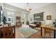 Living room with hardwood floors, featuring a rustic wood wall accent at 1315 East Blvd # 203, Charlotte, NC 28203