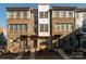 Three-story brick townhouses with modern design and landscaping at 1326 Gleason Way, Charlotte, NC 28217