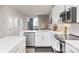 Modern kitchen with white cabinets, stainless steel appliances and breakfast bar at 1326 Gleason Way, Charlotte, NC 28217