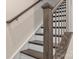 Modern staircase with dark wood handrail and metal balusters at 1326 Gleason Way, Charlotte, NC 28217