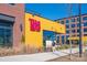 Modern Taco Bell restaurant exterior with a yellow facade and pedestrian walkway at 1326 Gleason Way, Charlotte, NC 28217