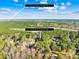 Aerial view showing home location near lake and town at 137 Deer Run Dr, Troutman, NC 28166