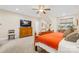 Bright bedroom with wood furniture and a large TV at 137 Deer Run Dr, Troutman, NC 28166