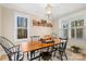 Farmhouse-style dining room with wood table and black chairs at 137 Deer Run Dr, Troutman, NC 28166