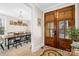 Bright dining room with farmhouse table and view into entryway at 137 Deer Run Dr, Troutman, NC 28166