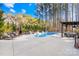 Inviting kidney-shaped pool with a pergola and lounge area at 137 Deer Run Dr, Troutman, NC 28166