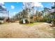 Large backyard with shed, stone patio, and mature trees at 1542 Colony Rd, Rock Hill, SC 29730