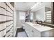 Updated bathroom with double vanity, black accents, and patterned shower curtain at 1542 Colony Rd, Rock Hill, SC 29730