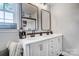 Double vanity bathroom with white cabinets and black accents at 1542 Colony Rd, Rock Hill, SC 29730