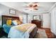 Bedroom with dark wood bed frame, yellow and grey bedding at 1542 Colony Rd, Rock Hill, SC 29730