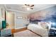 Cozy bedroom with mountain mural, daybed, and ceiling fan at 1542 Colony Rd, Rock Hill, SC 29730