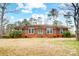 Brick ranch house with a landscaped lawn and mature trees at 1542 Colony Rd, Rock Hill, SC 29730