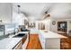 Modern kitchen with farmhouse sink, white cabinets, and butcher block shelving at 1542 Colony Rd, Rock Hill, SC 29730