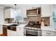 Modern kitchen with stainless steel appliances and white shaker cabinets at 1542 Colony Rd, Rock Hill, SC 29730