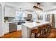 Modern kitchen featuring white cabinets, a large island, and stainless steel appliances at 1542 Colony Rd, Rock Hill, SC 29730