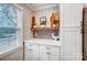 White kitchen cabinets and gray brick backsplash at 1542 Colony Rd, Rock Hill, SC 29730