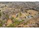 Aerial view showing home, pool, and surrounding property at 160 Pampas Ln, Mooresville, NC 28117