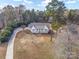 Aerial view of a charming ranch house with a large front yard and long driveway at 160 Pampas Ln, Mooresville, NC 28117