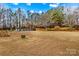 Large backyard with above ground pool and surrounding trees at 160 Pampas Ln, Mooresville, NC 28117