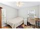 Bedroom with full-size bed, desk, and hardwood floors at 160 Pampas Ln, Mooresville, NC 28117