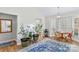 Bright dining area with bay window, wood table and chairs, and hardwood floors at 160 Pampas Ln, Mooresville, NC 28117