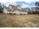 House exterior showcasing a ranch-style home with a front porch and landscaping at 160 Pampas Ln, Mooresville, NC 28117