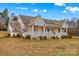 House exterior showcasing a front porch and well-maintained landscaping at 160 Pampas Ln, Mooresville, NC 28117