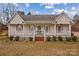 House with a large front porch and landscaping at 160 Pampas Ln, Mooresville, NC 28117