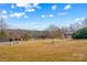 Landscaped front yard with a view of neighboring homes at 160 Pampas Ln, Mooresville, NC 28117