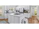 Modern kitchen with white cabinetry, stainless steel appliances, and an island at 160 Pampas Ln, Mooresville, NC 28117