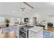 Kitchen with island, stainless steel appliances and open to living area at 160 Pampas Ln, Mooresville, NC 28117