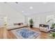 Living room with vaulted ceiling, hardwood floors, and sectional sofa at 160 Pampas Ln, Mooresville, NC 28117