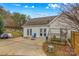 Backyard patio with attached workshop and small greenhouse at 160 Pampas Ln, Mooresville, NC 28117