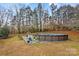 Above ground pool with surrounding patio and seating at 160 Pampas Ln, Mooresville, NC 28117