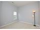 Bright bedroom featuring a floor lamp and window at 16220 Circlegreen Dr, Charlotte, NC 28273