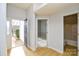 Bright entryway with access to a bathroom, and a view into a living room at 16220 Circlegreen Dr, Charlotte, NC 28273