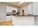 Kitchen island with granite countertop and white cabinets at 16220 Circlegreen Dr, Charlotte, NC 28273