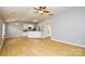 Open kitchen with island, light cabinets and hardwood floors at 16220 Circlegreen Dr, Charlotte, NC 28273