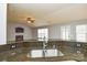 Kitchen sink and granite countertop with view to living room at 16220 Circlegreen Dr, Charlotte, NC 28273