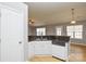 Kitchen with white cabinets, granite counters, and dishwasher at 16220 Circlegreen Dr, Charlotte, NC 28273