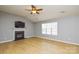 Bright living room with gas fireplace and wood-look floors at 16220 Circlegreen Dr, Charlotte, NC 28273