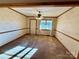 Formal dining room with wood-paneled wainscoting and carpet at 1824 N Charlotte Ave, Monroe, NC 28110