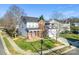 Two-story house with a gray roof and brick exterior, in a neighborhood setting at 2003 Galty Ln, Charlotte, NC 28270