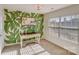 Bedroom with a leafy green accent wall and a vintage-style writing desk at 2003 Galty Ln, Charlotte, NC 28270