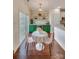 Charming breakfast nook with green cabinets and floral wallpaper at 2003 Galty Ln, Charlotte, NC 28270