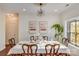 Bright dining room features a chandelier, hardwood floors, and a stained-glass window at 2003 Galty Ln, Charlotte, NC 28270